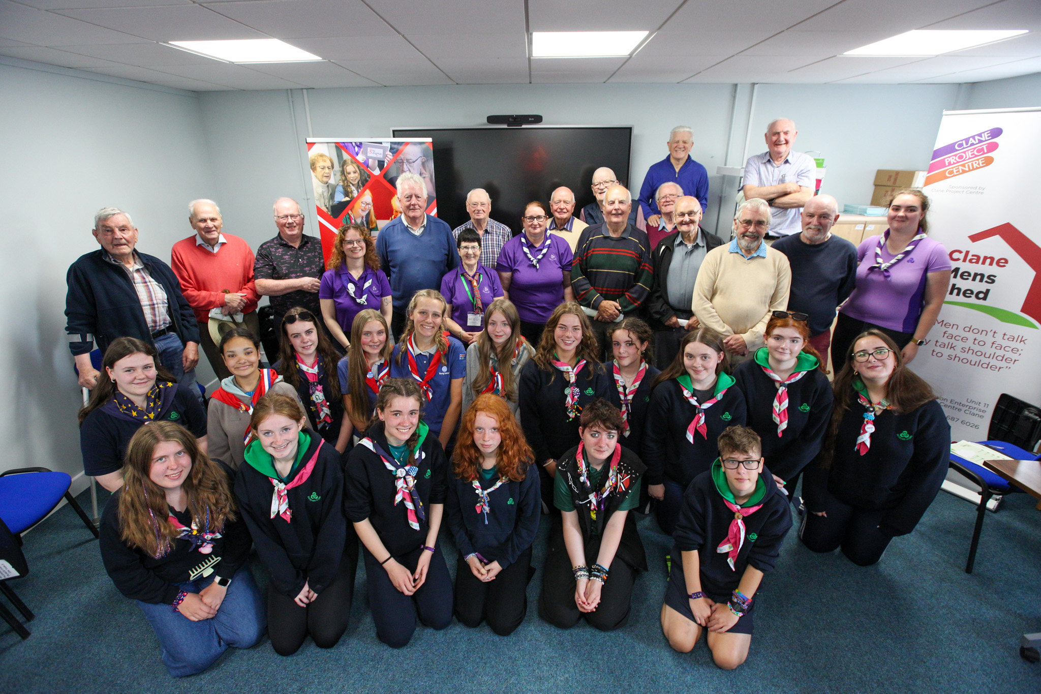 photograph of Irish Girl Guides and Kildare Men's Shed together in a group, smiling