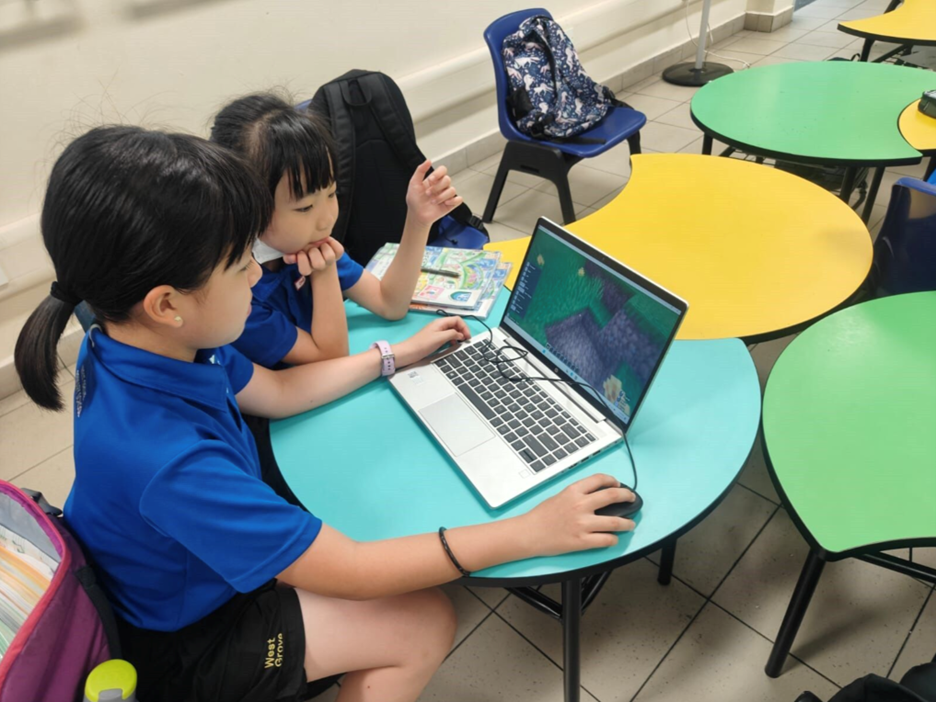 Girls leading girls through the Minecraft world.